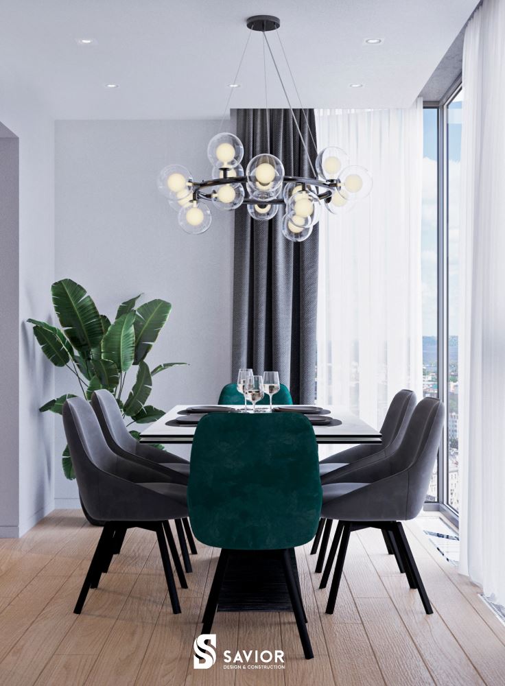 Bàn ăn đặt bên cạnh ô cửa sổ lớn thoáng đãng