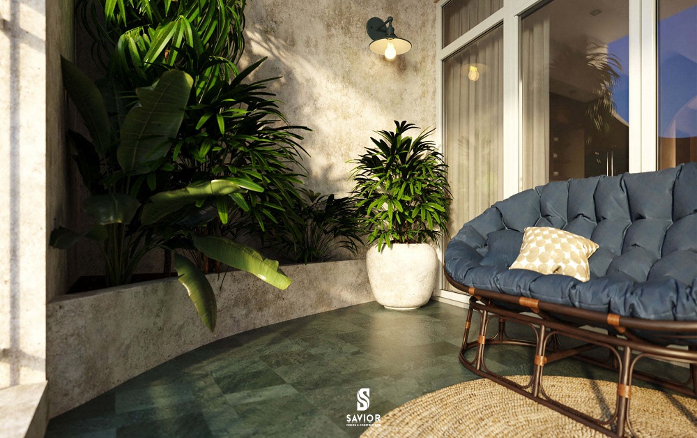 Nền lát đá bazan mài hone xanh rêu, hòa mình với màu xanh của cây cối. 